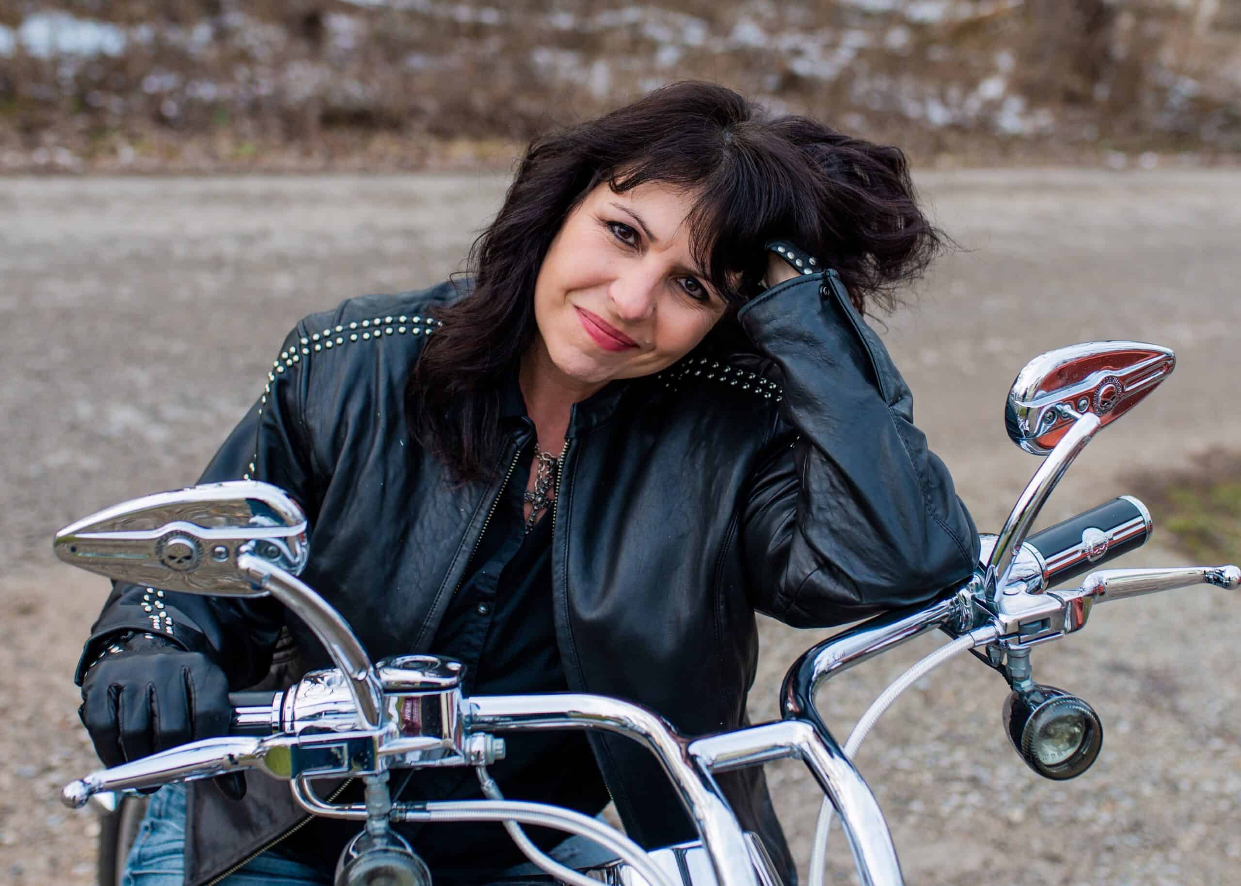 Close up of woman sitting on a motorcycle