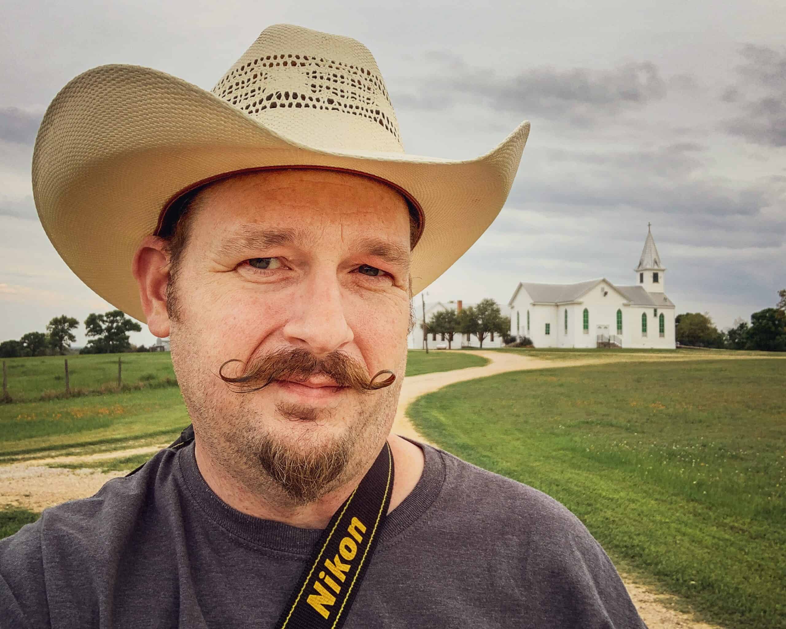 Photographer with church in background