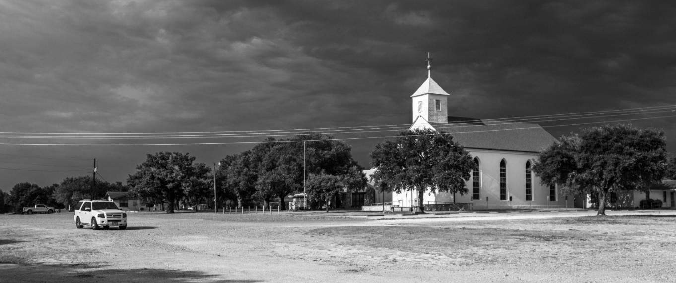Black and white side shot of old church in Texas